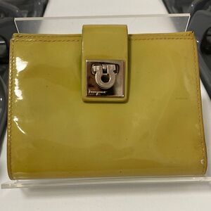 Salvatore Ferragamo Patent Leather Compact Wallet with Gancini Clasp.